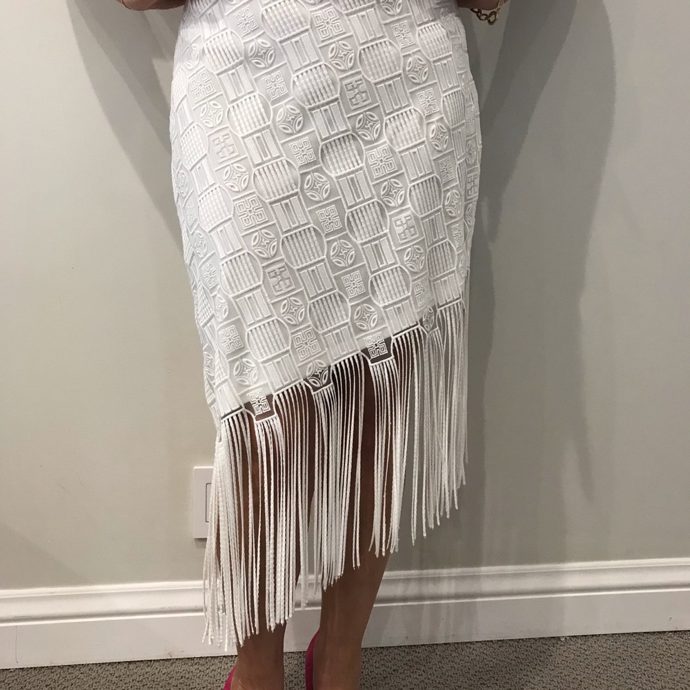 White lace skirt with fringe.